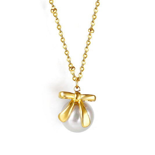 Bow + white pearl pendant necklace